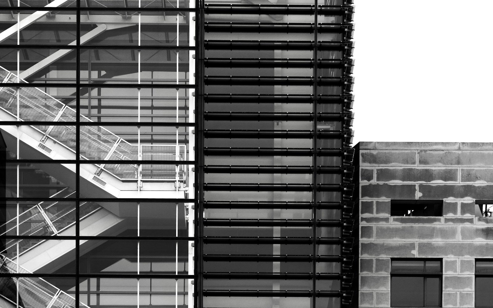 Close detail of glass, steel and concrete in a modern building façade.