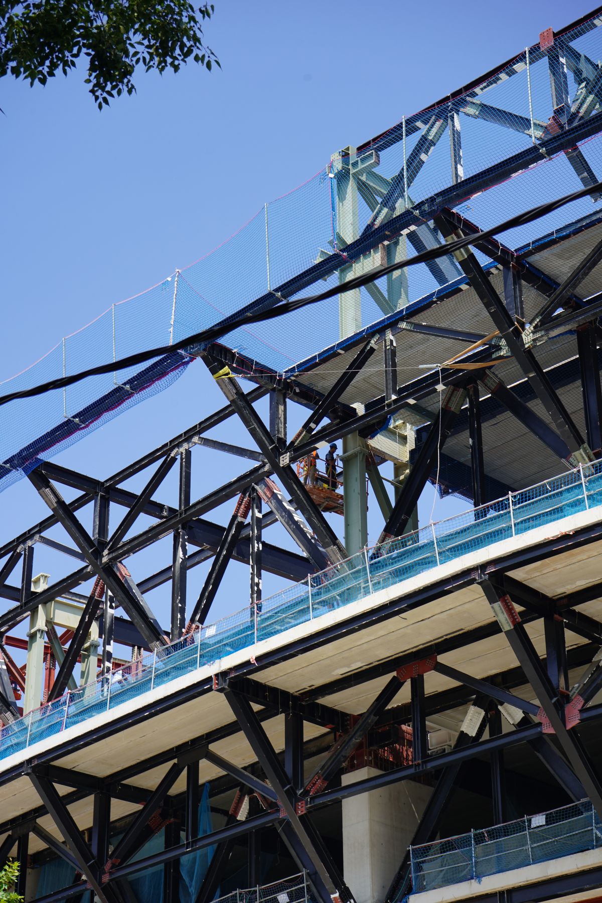 Exposed steel framing and bracing during construction.